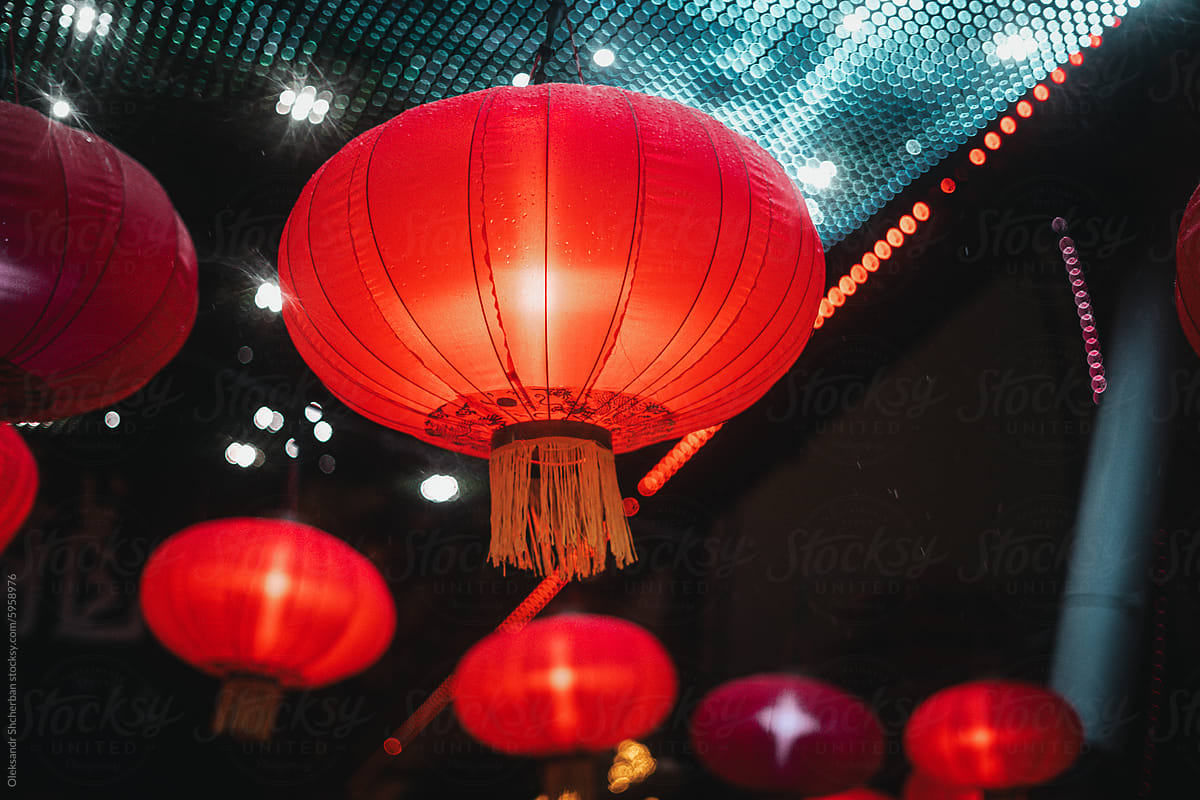 Hanging red chinese lanterns on blue background