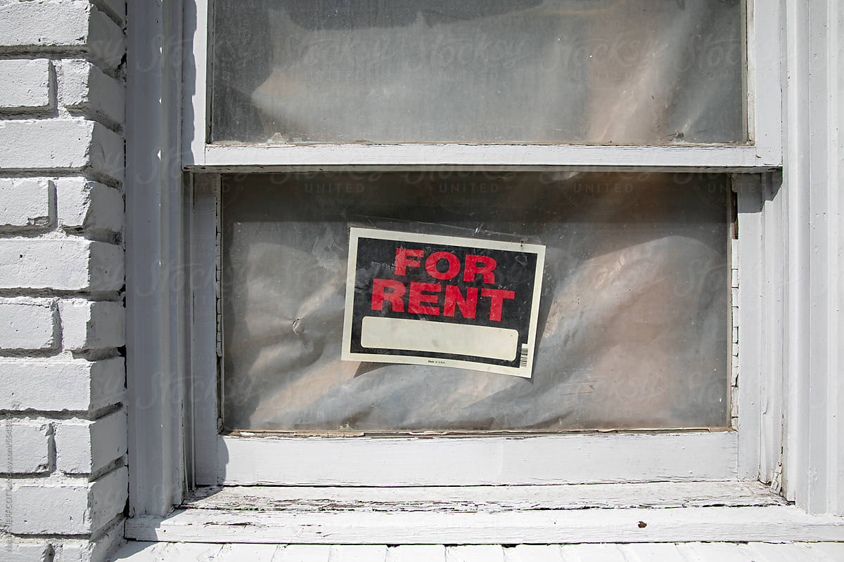 For rent sign in building window