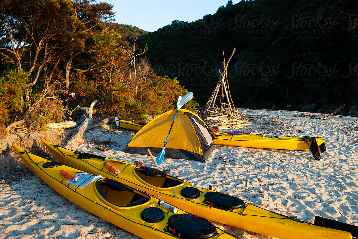 Sea kayaks on beach, New Zealand.