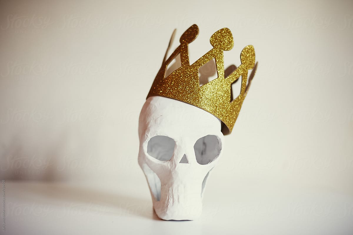 Skull wearing a gold crown