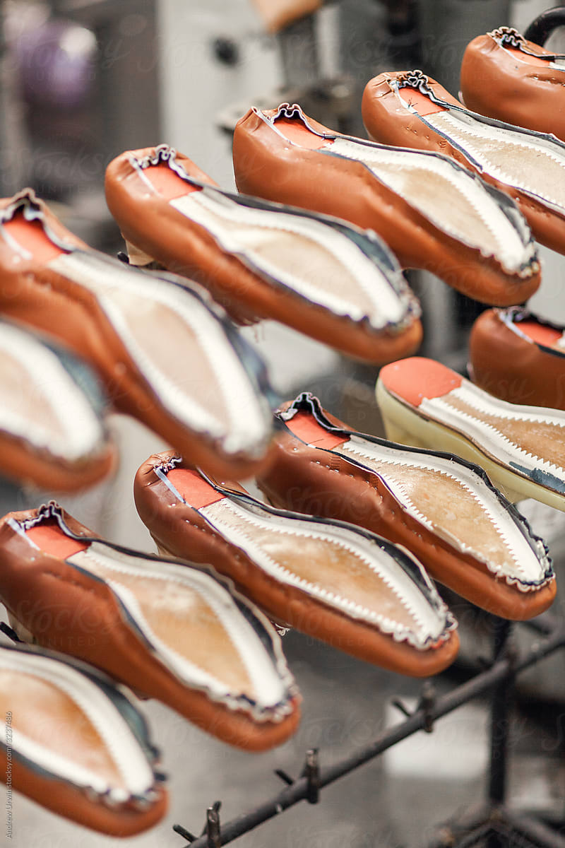 A rack of shoes half made in a shoe factory
