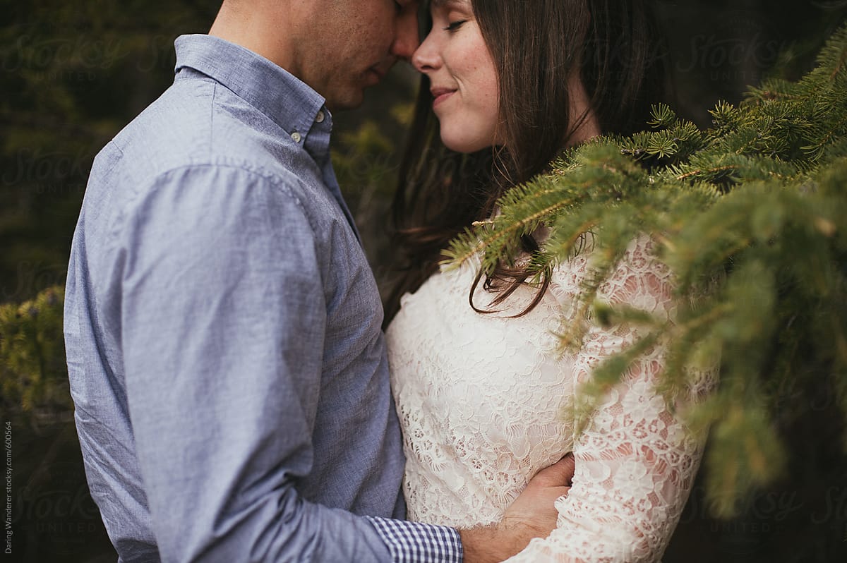 Couple Hugging Close In Forest By Stocksy Contributor Jess Craven