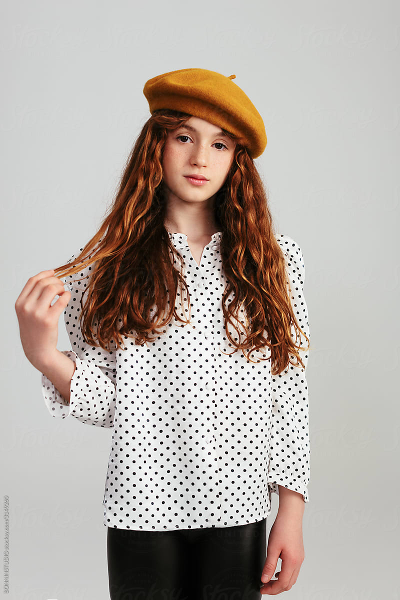 Stylish girl with a yellow beret