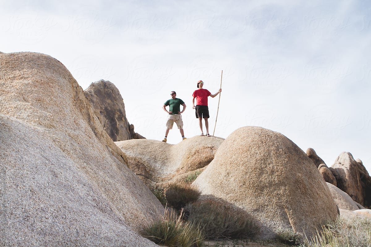 Two Guys Standing on Desert Rocks