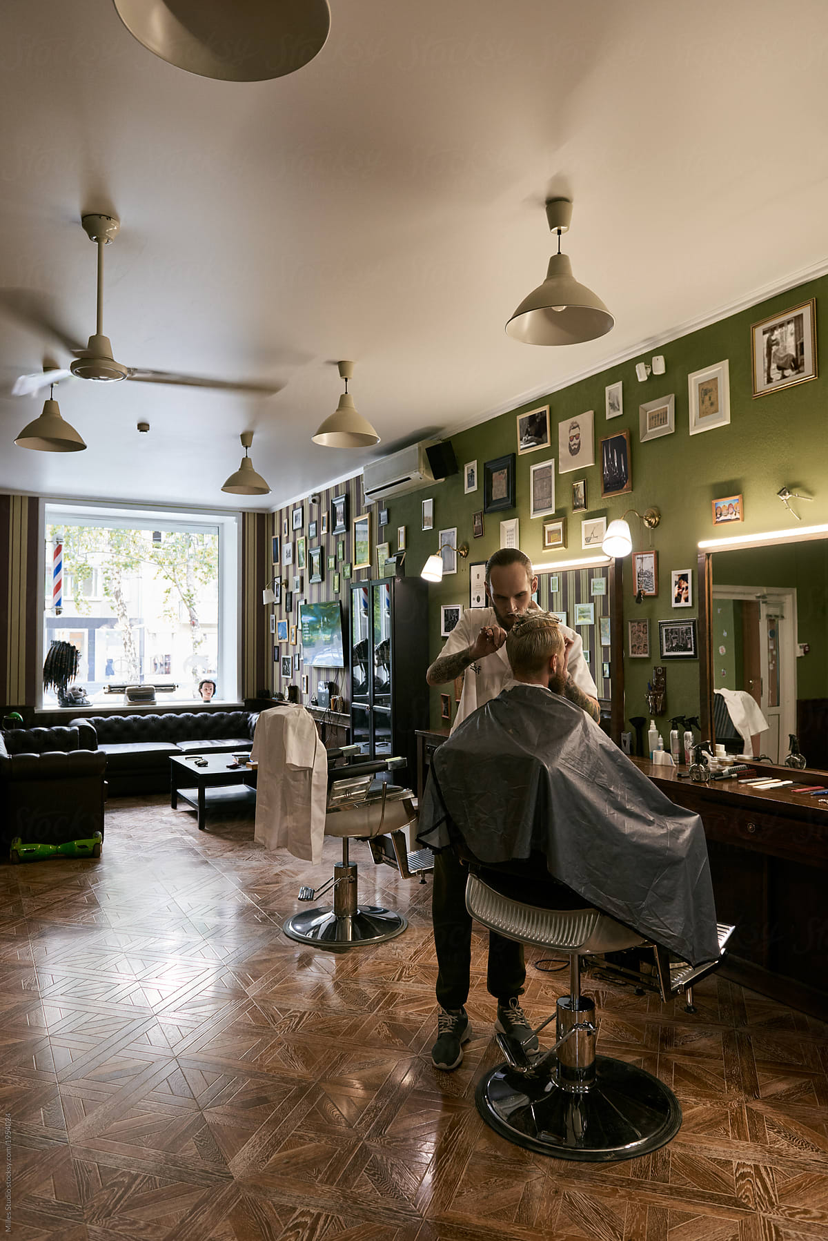 Barber working with client in salon