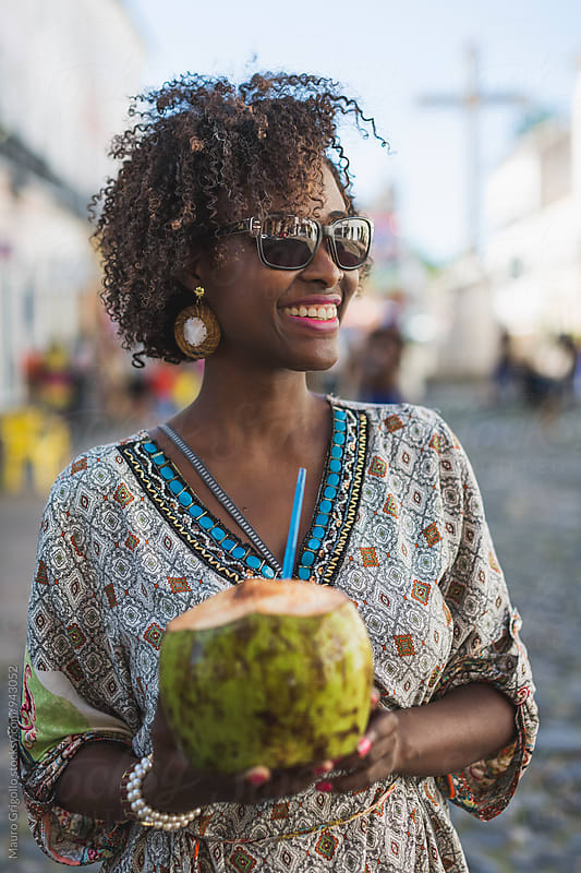 Brazilian Woman drinking coconut water