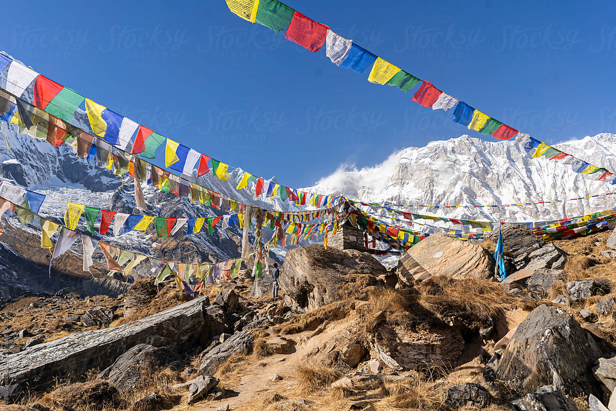 Snowcapped mountains and Tibetan  flags of prayers in the Himalaya