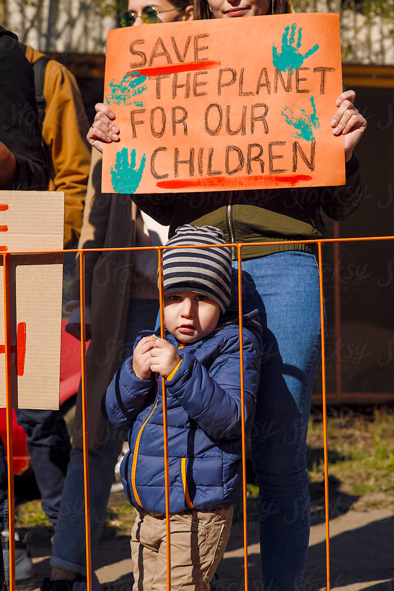 Toddler with mom on protest against pollution