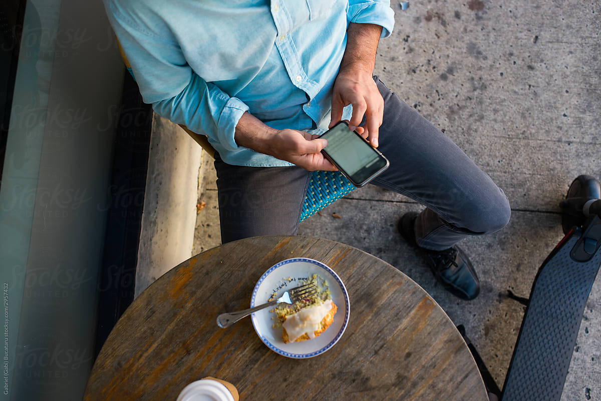 man with cell phone on a coffee break