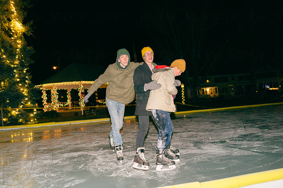 UGC three teen boys having fun on skates at night