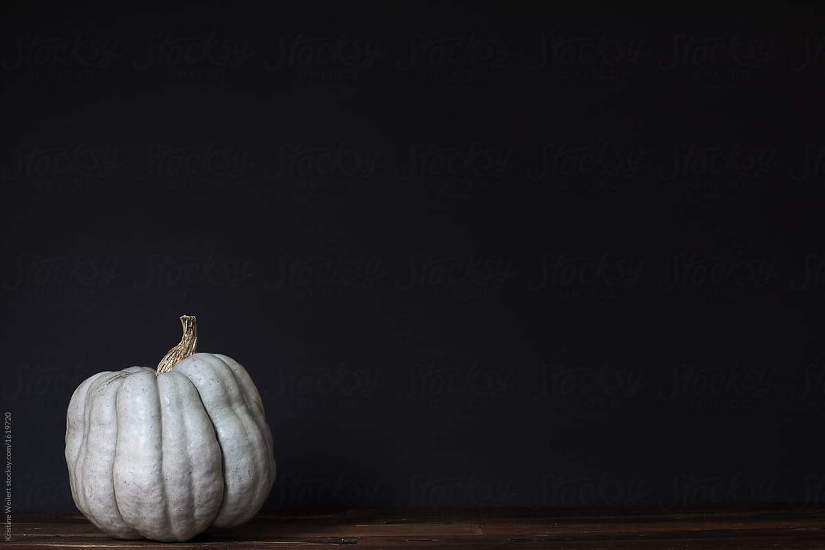 Light green pumpkin on dark background
