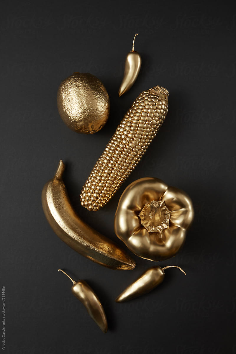 Golden painted vegetables and fruits.