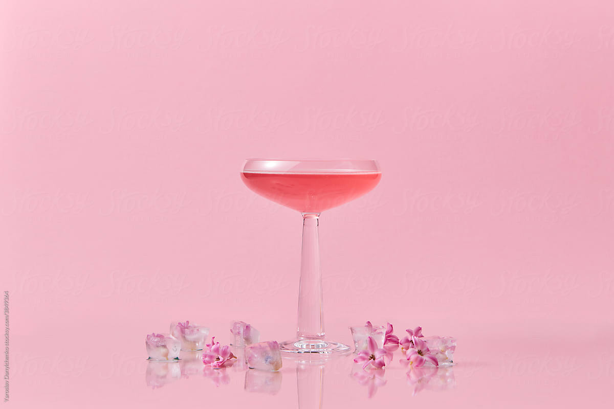 Drink in glass and flowers in cubes