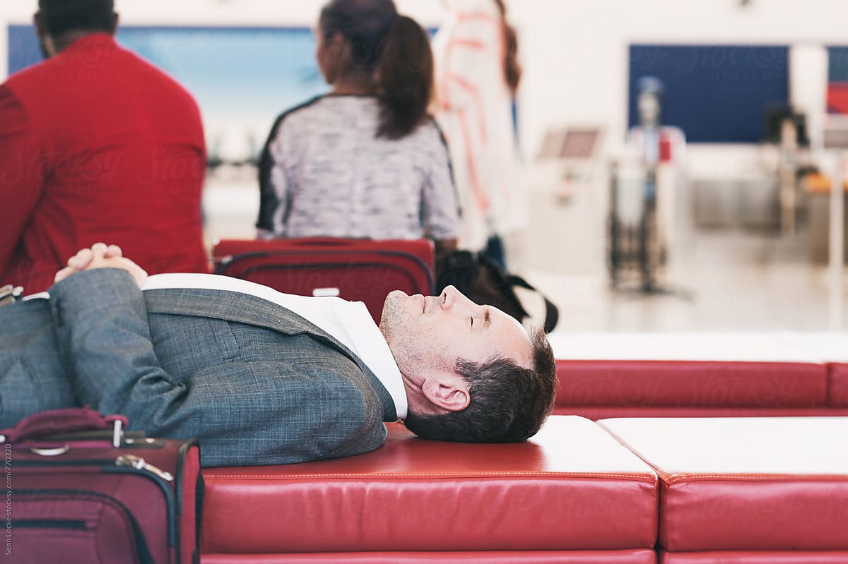 Airport: Man Takes Quick Nap In Airport Terminal