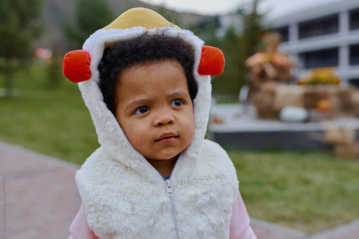 little girl in a Halloween chicken costume