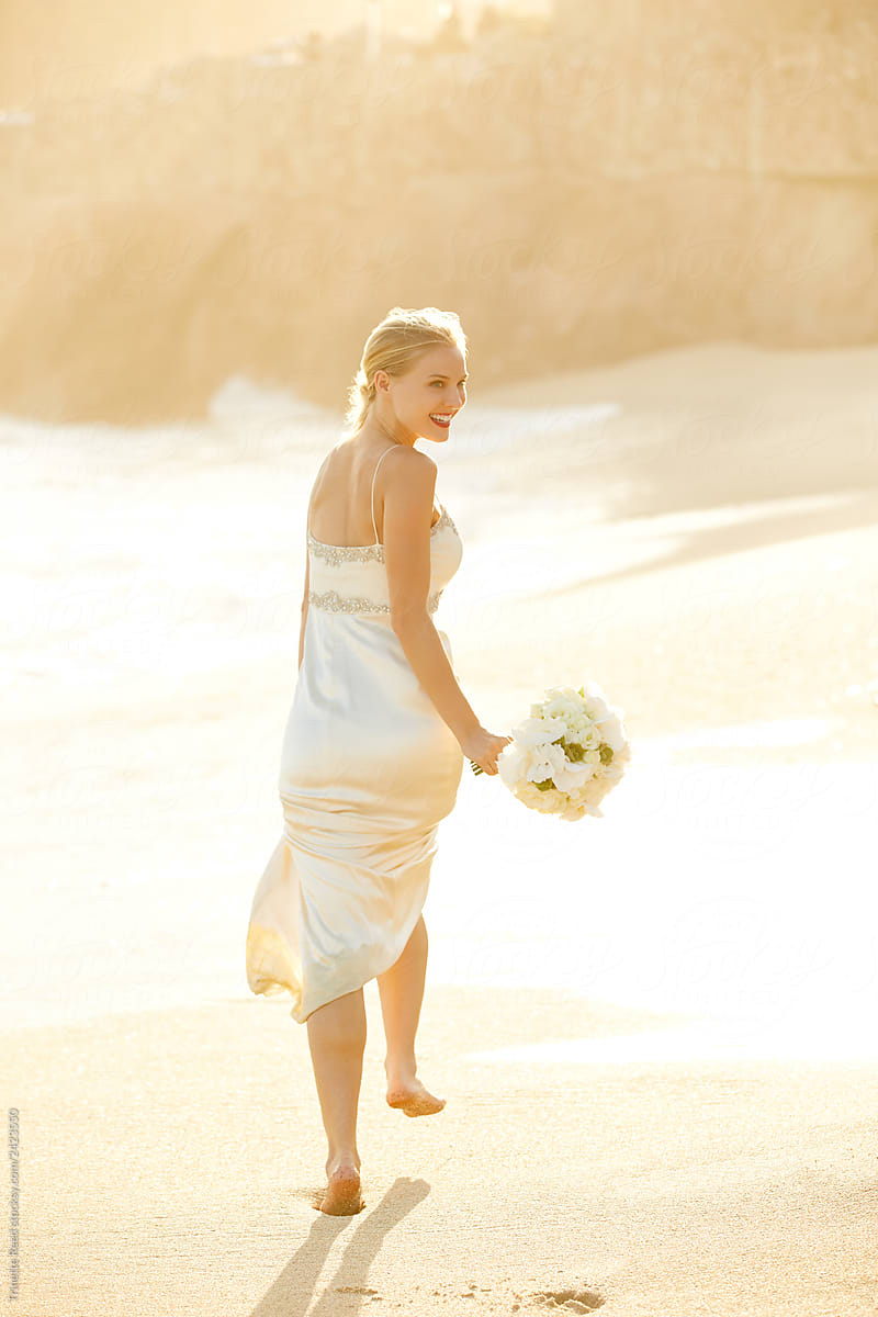 Newly married bride on the beach in Mexico