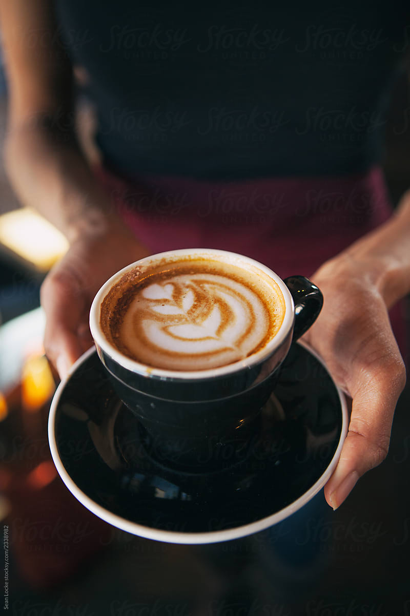 Cafe: Server Holding Fancy Latte With Art In The Foam