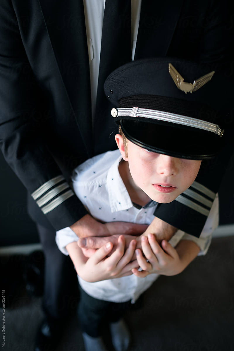 Boy Wearing his Dad\'s Pilot Hat
