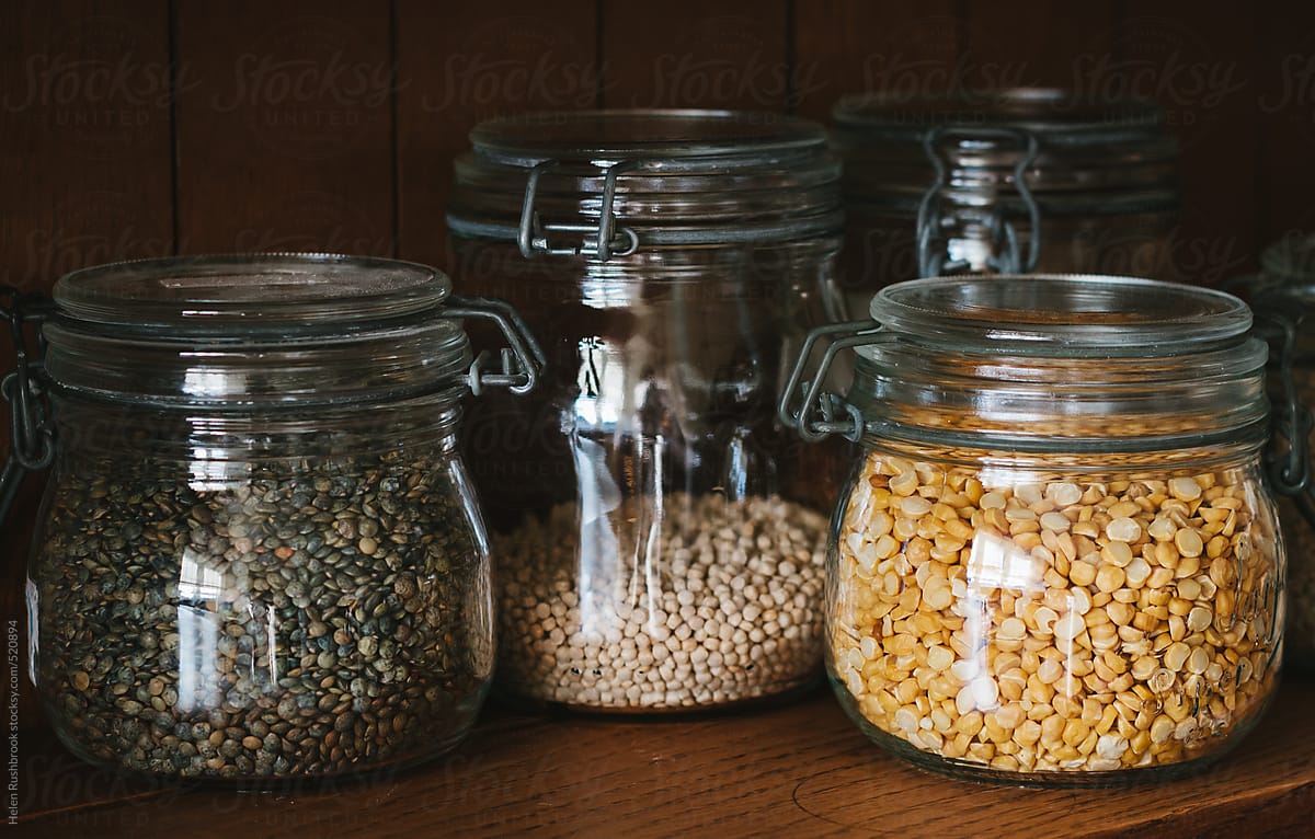 Lentils and other dry goods in glass storage jars.