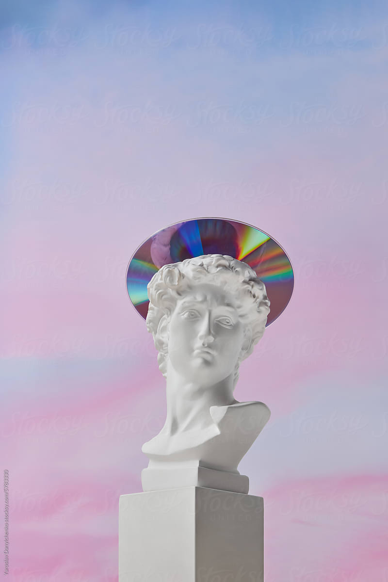 Gypsum statue of David with plastic CD disc on head as halo in studio