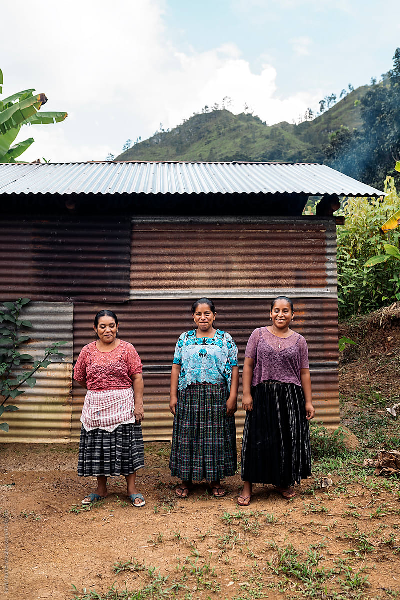 Portrait of guatemalan family women close to her home.