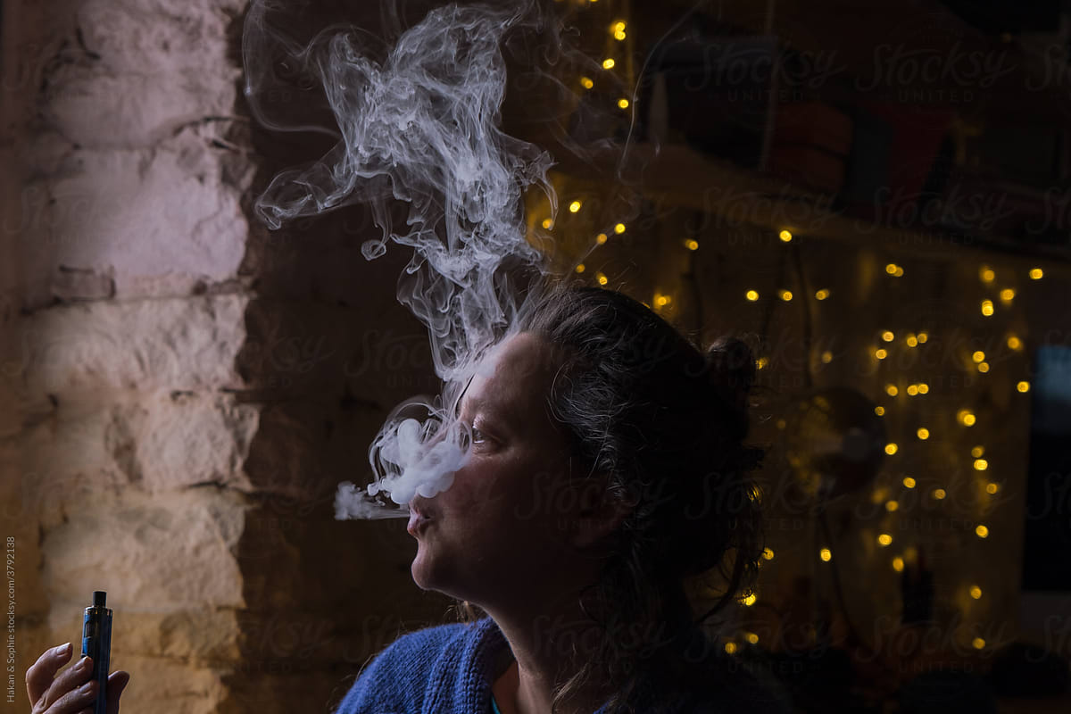 woman enjoying smoke.