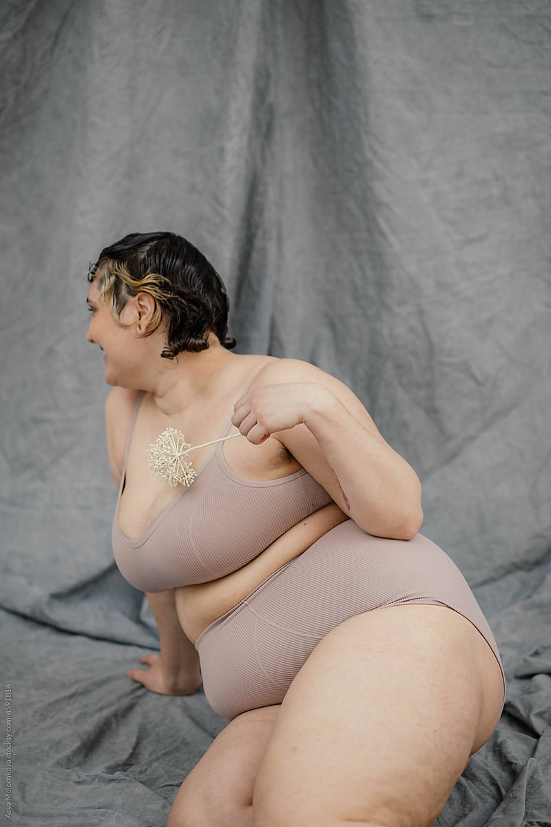 Young Plus Size Model Posing Naked In Studio by Stocksy Contributor Asya  Molochkova - Stocksy