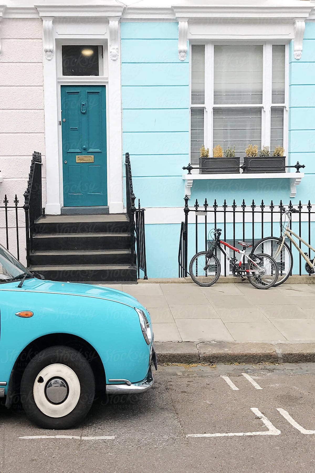 Blue car and house front in Primrose Hill, London
