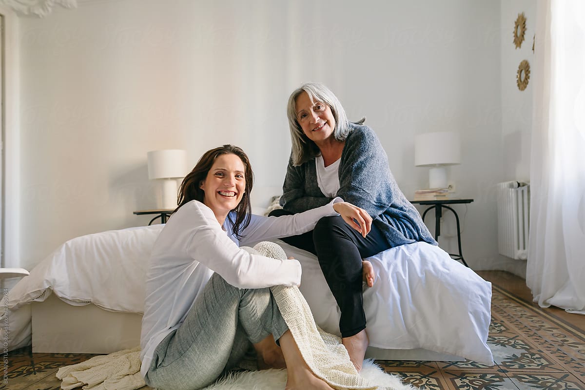 Mother And Her Daughter Talking Together On The Room At Morning By Stocksy Contributor 