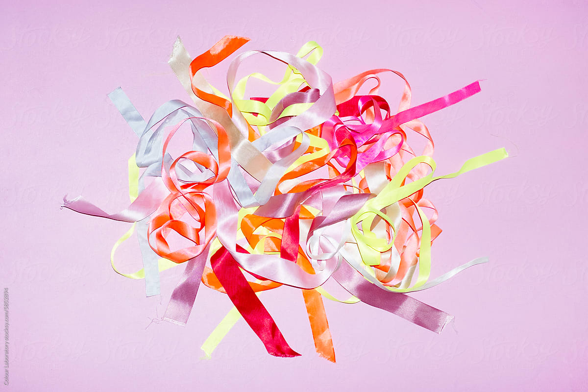 Colourful bright neon and pastel silk ribbons with hard direct flash
