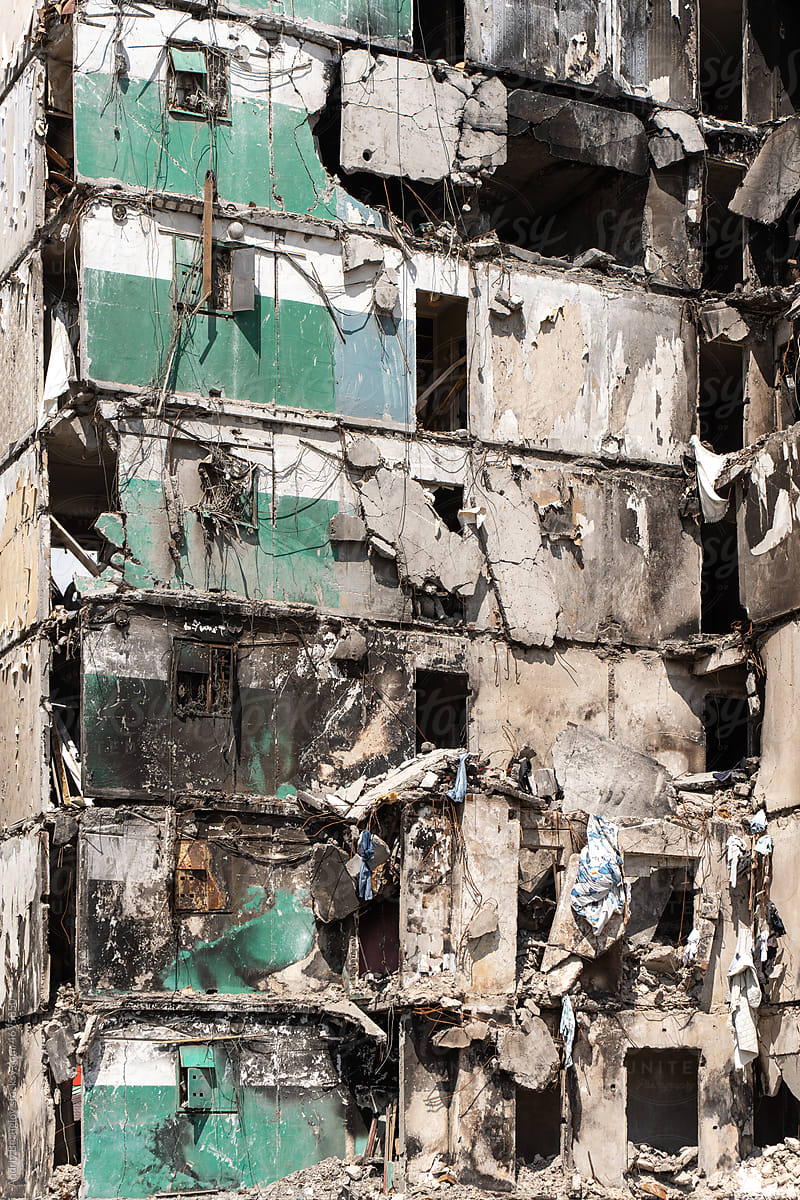 Facade of a bombed-out apartment building.