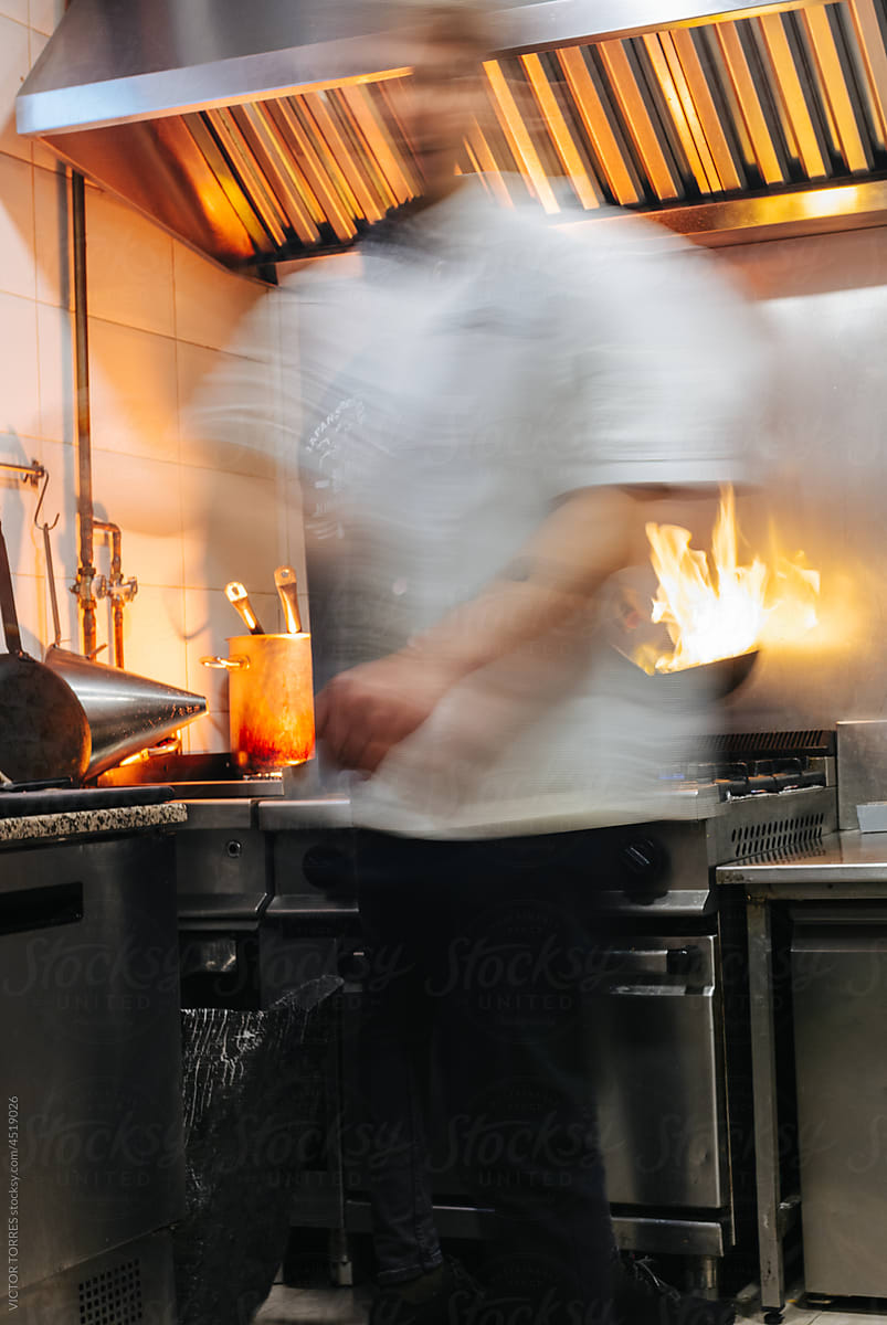 "Men Cooking In Kitchen" by Stocksy Contributor "VICTOR TORRES" - Stocksy