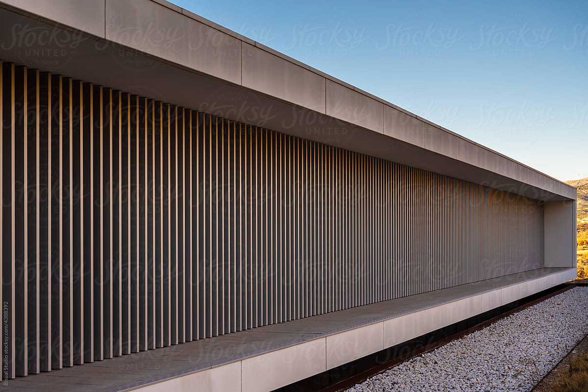 Concrete wall of modern building under blue sky