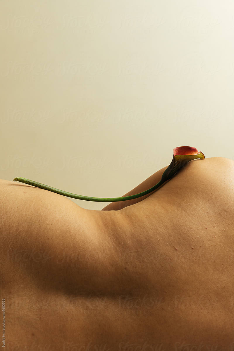 Still life of calla lily on human body