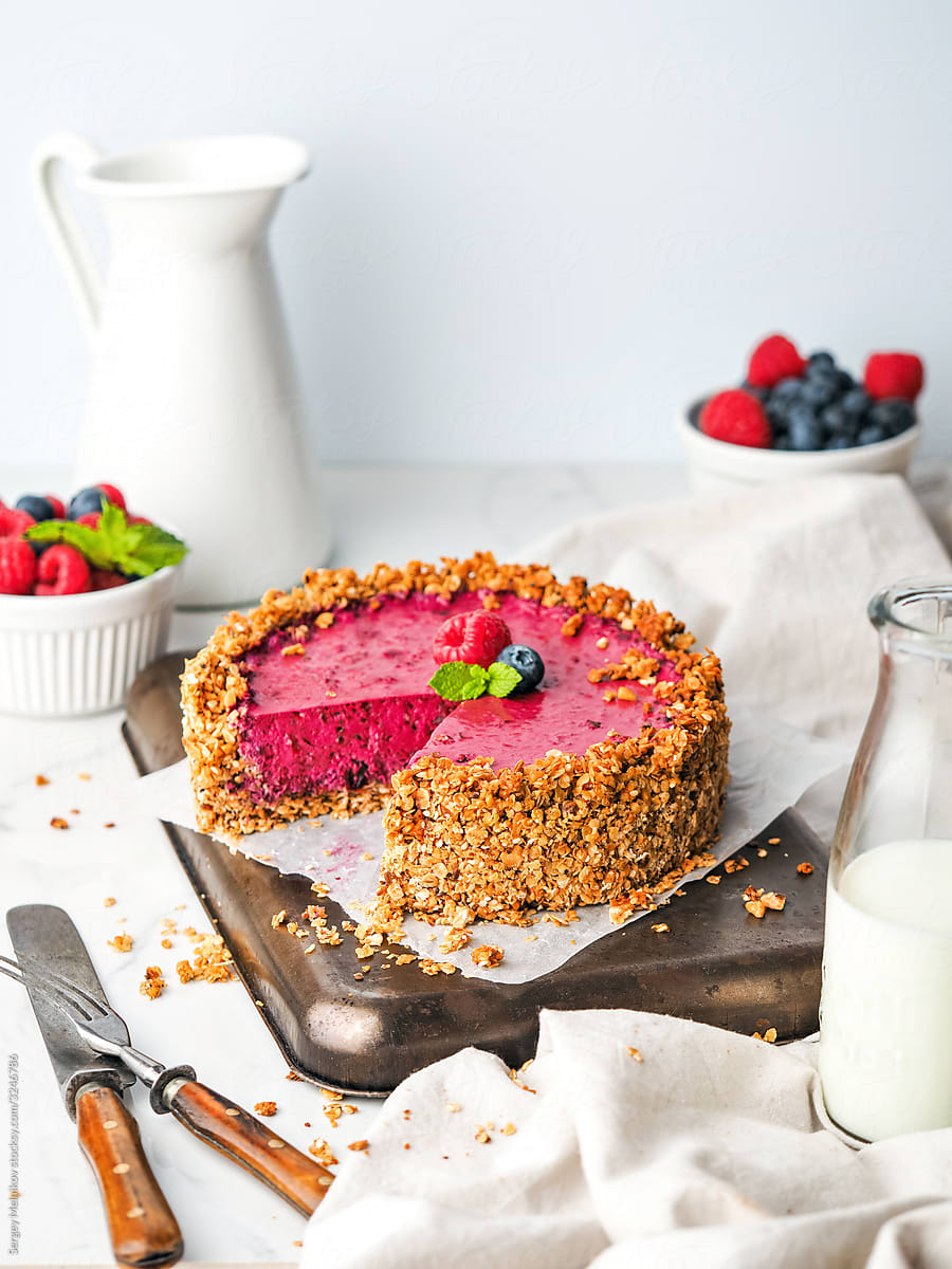 Cut berry cake on table
