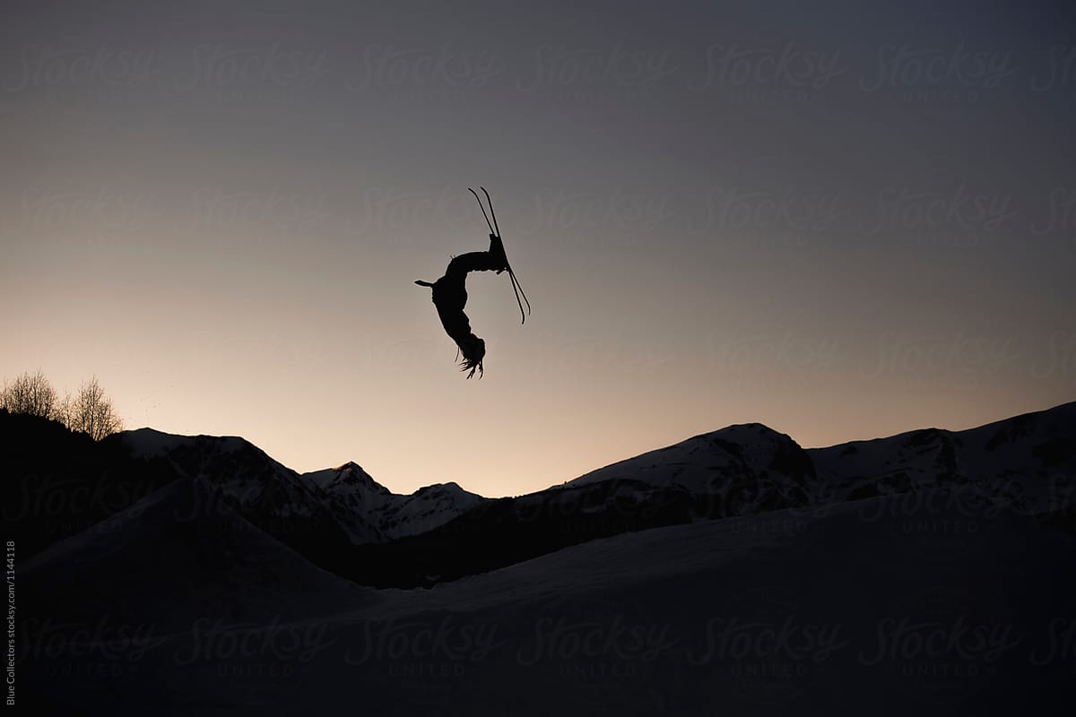 Silhouette Of Skier In Mid Air From The Big Jump Freestyle At Sunset By Blue Collectors Silhouette Skier Stocksy United
