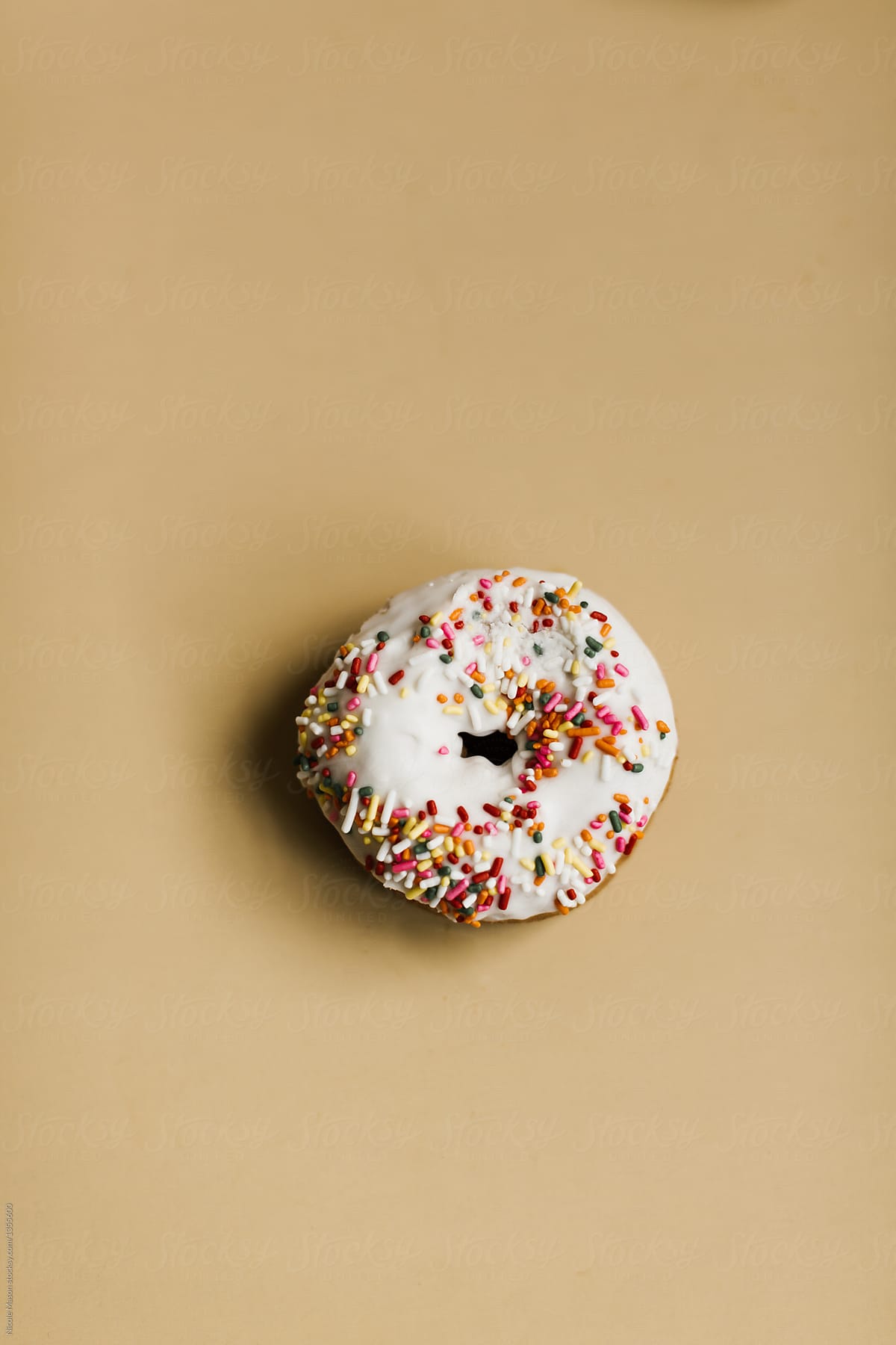 sprinkle donut on gold background