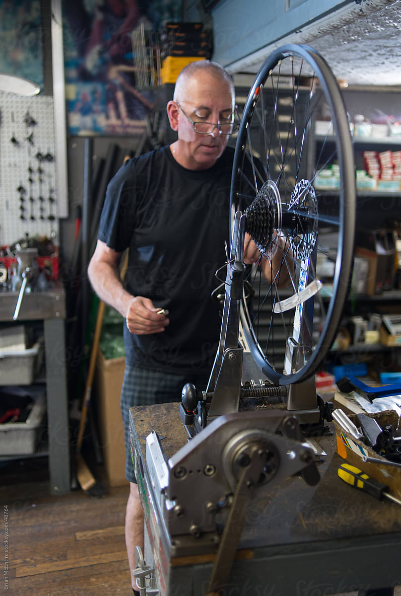 Local Bike Shop: Store Owner at Work in Mechanical Area
