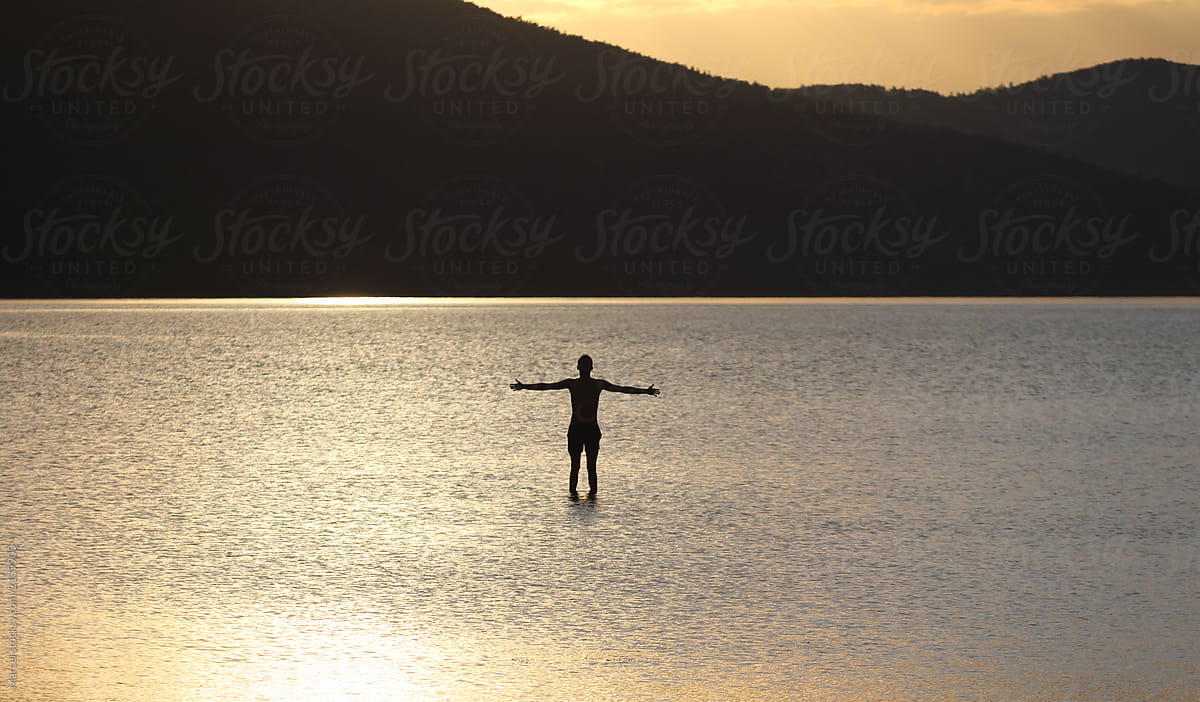 Young man walking on water