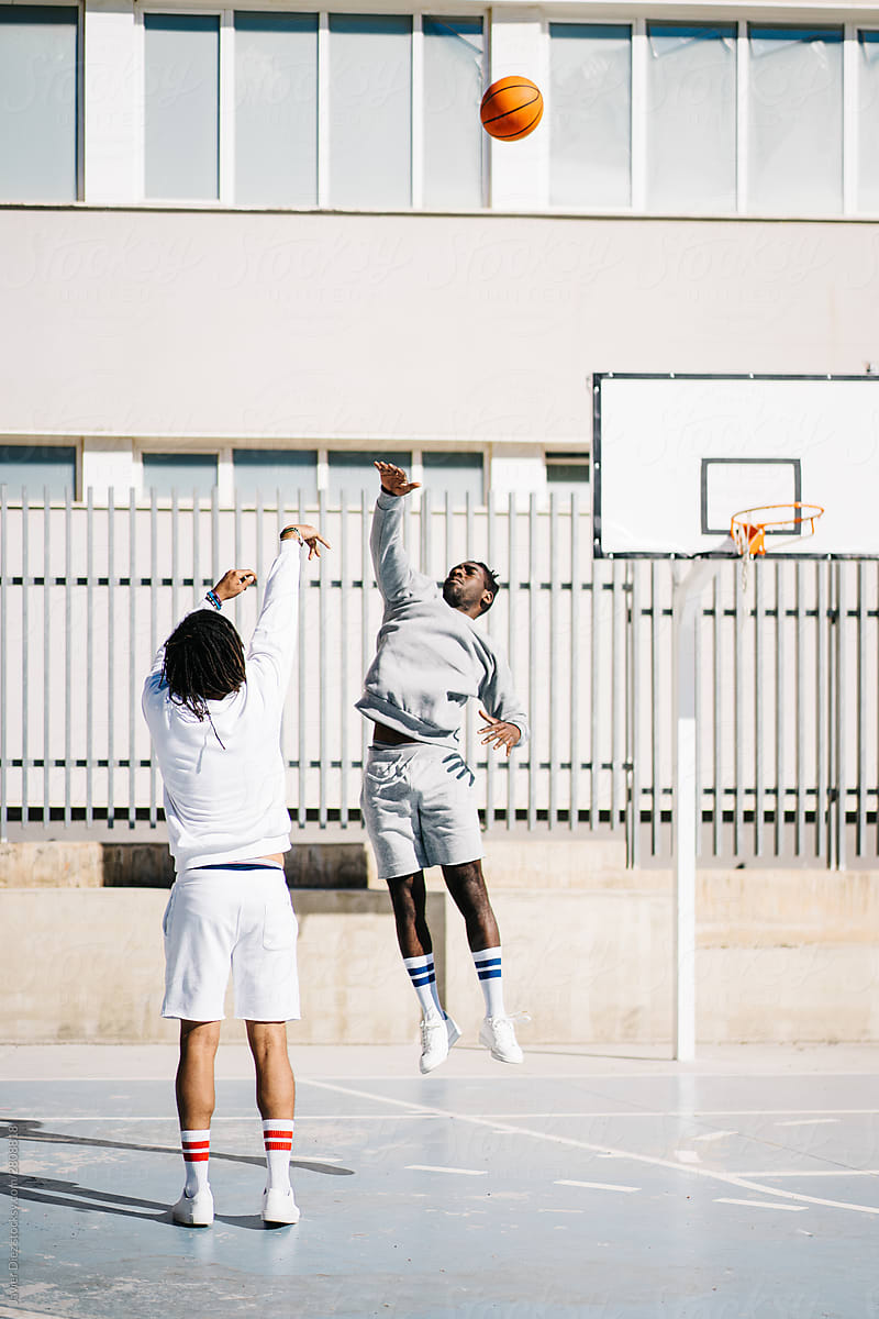 Basketball player practicing on street court