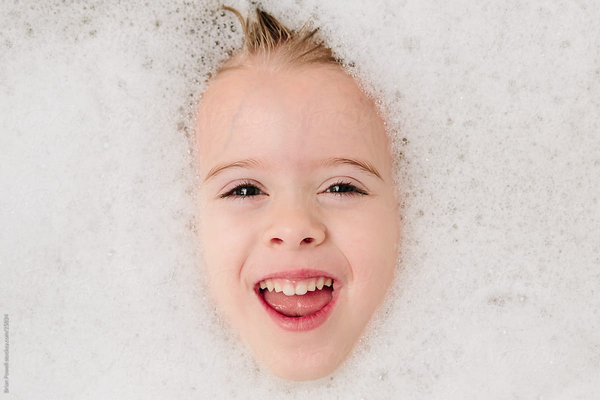 girl washing her hair in bubble bath