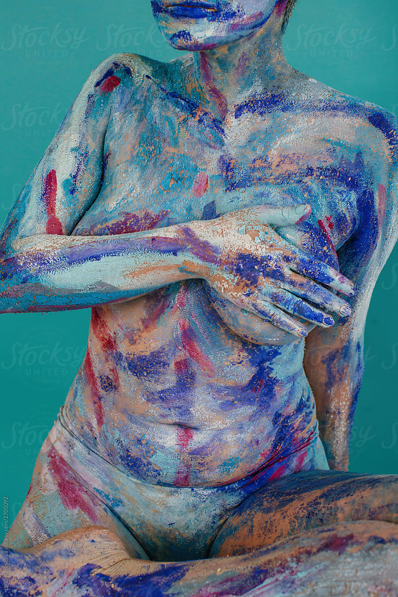 Naked body covered with paints
