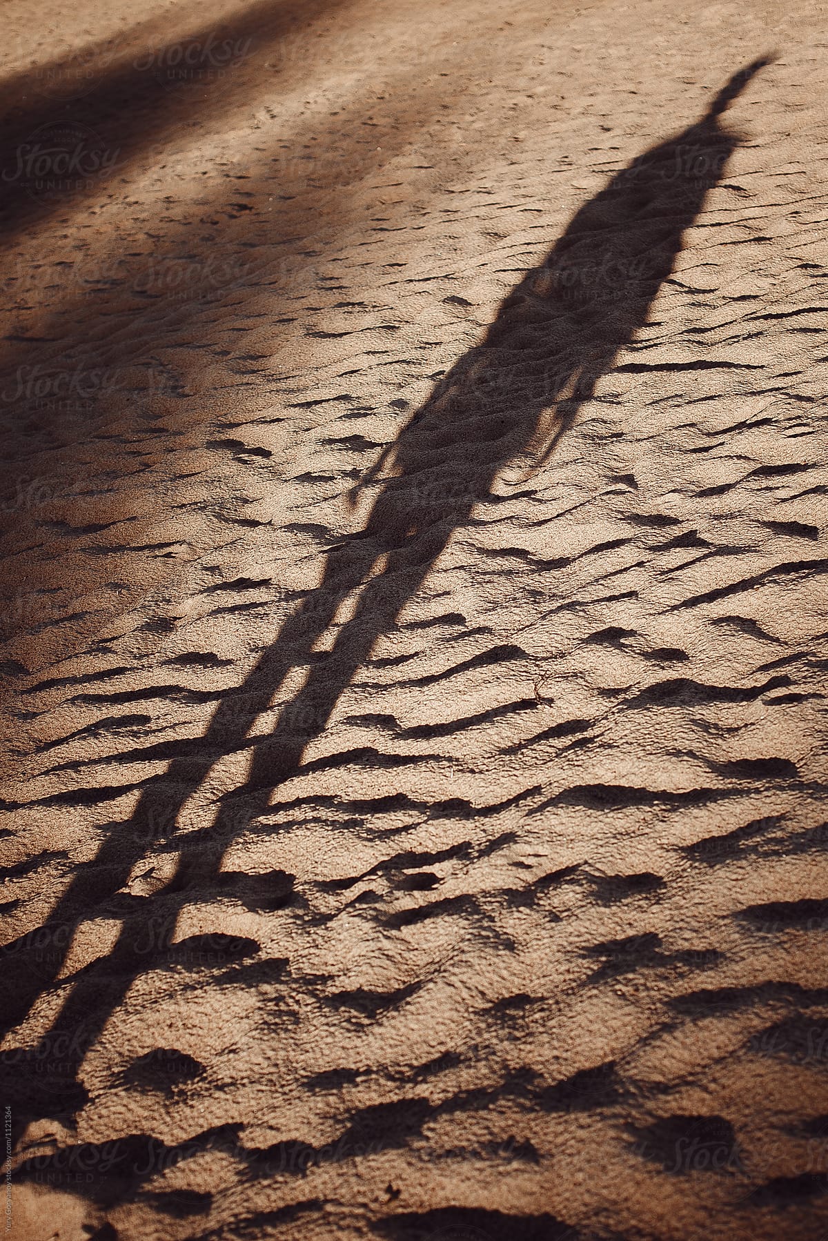 shadow of a man on the sand