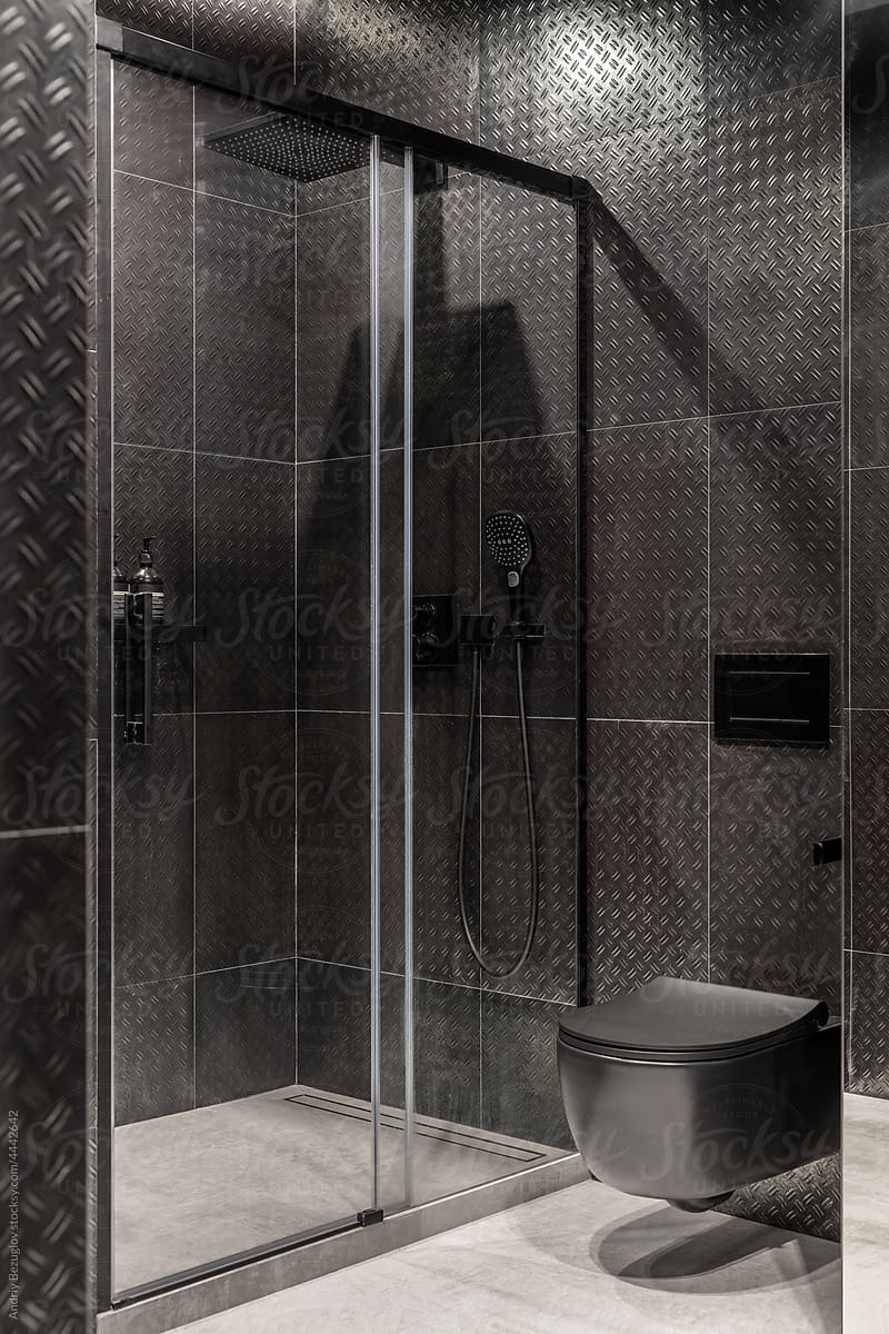 Luminous bathroom in contemporary style with dark walls
