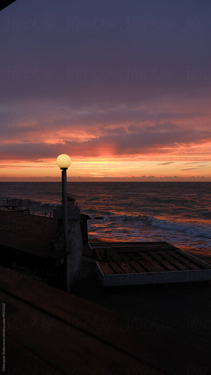 Sunrise on sea. \
Orange sky.Amazing red sunrise on beach.