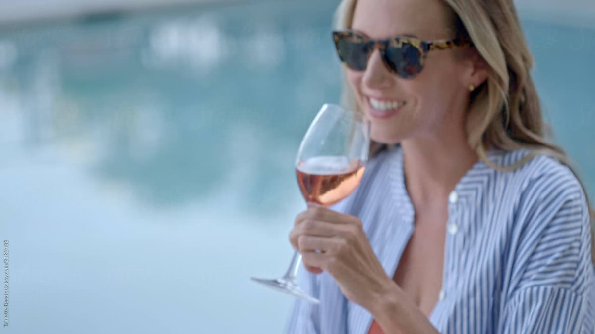 Couple Enjoying Wine Poolside At Luxury Resort By Stocksy Contributor Trinette Reed Stocksy 2380