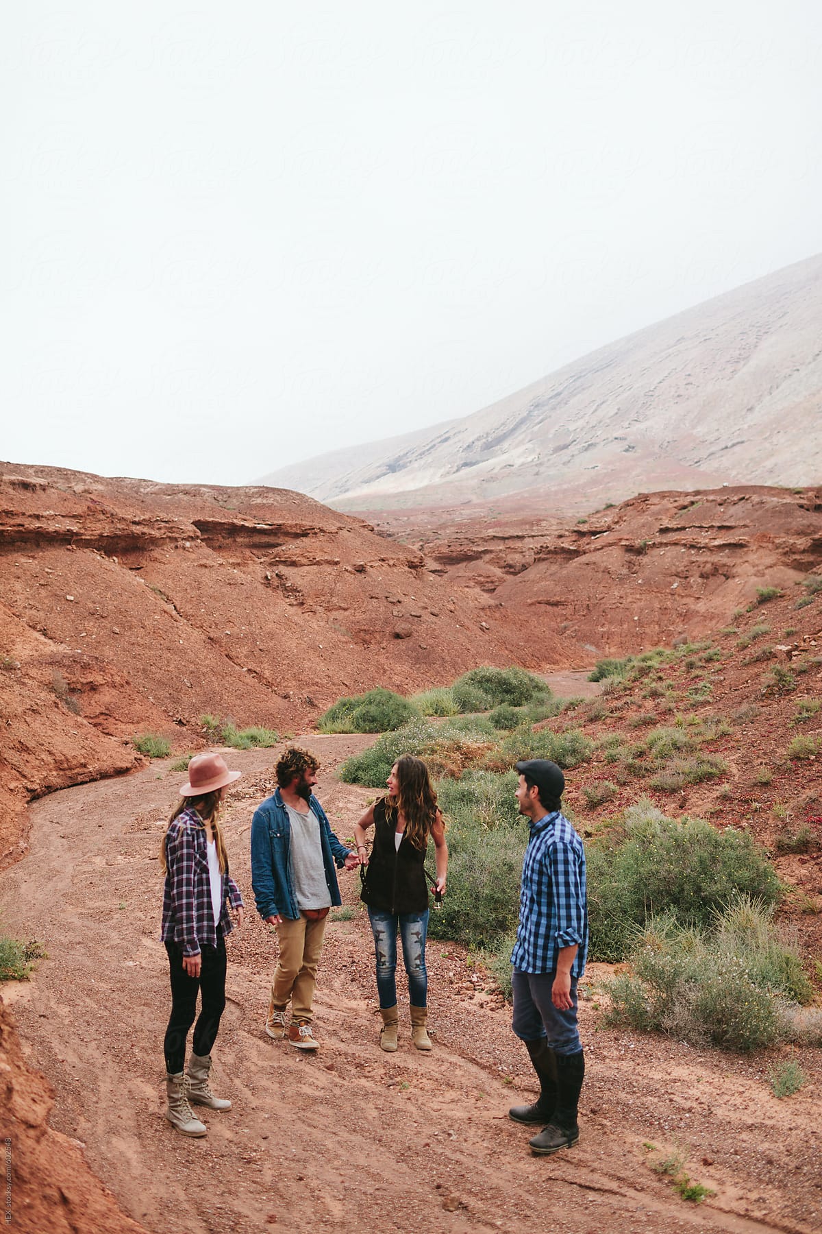 Group of Friends Walking Through a Desert Together