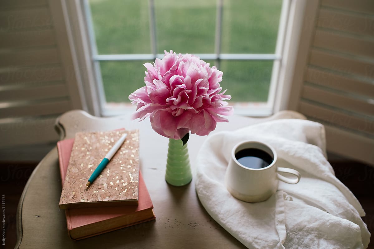 journal, book, coffee, and flower on a desk by Kelly Knox - Coffee