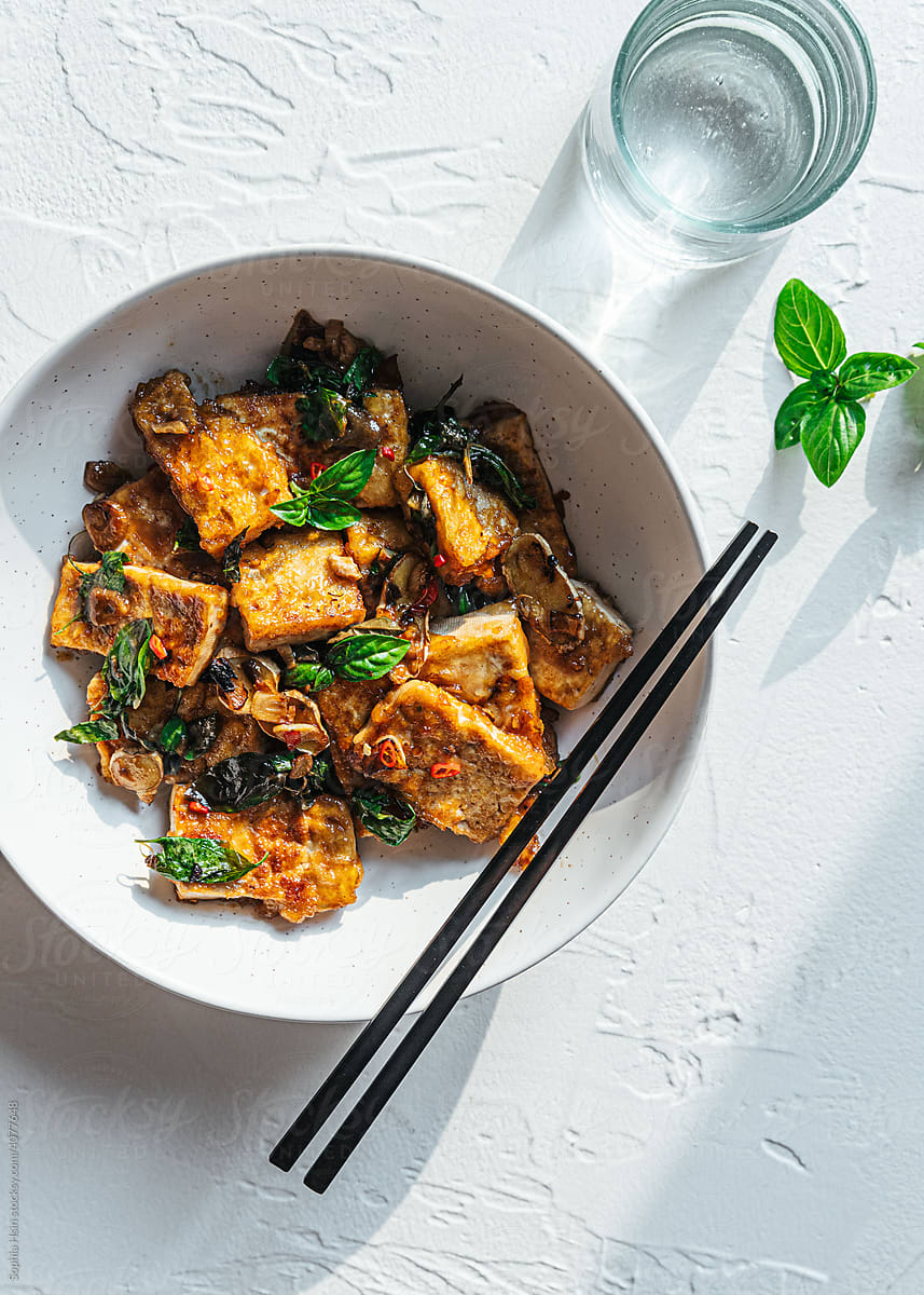 Vegan tofu stir fry in ceramic bowl