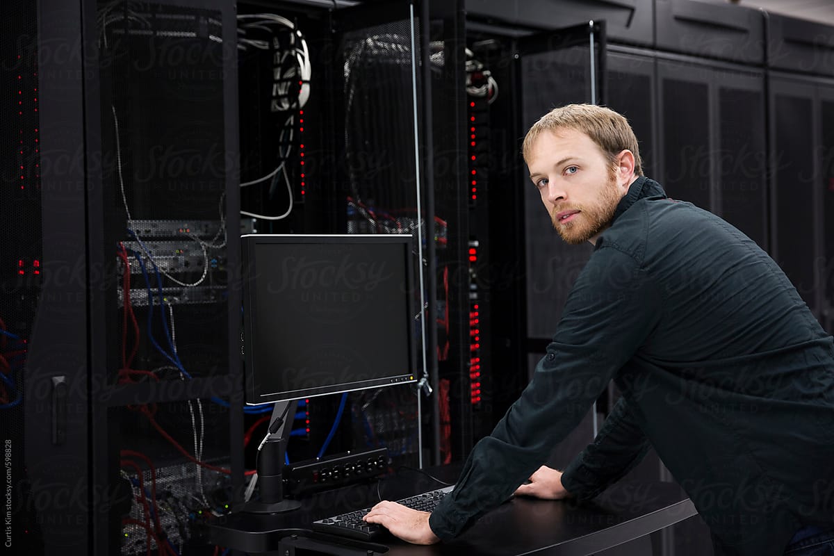Young IT professional working on datacenter servers